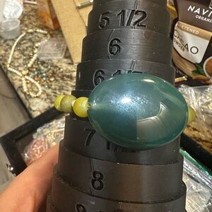Large Green chunk is Jade others ate stone and crystal stretch bracelet